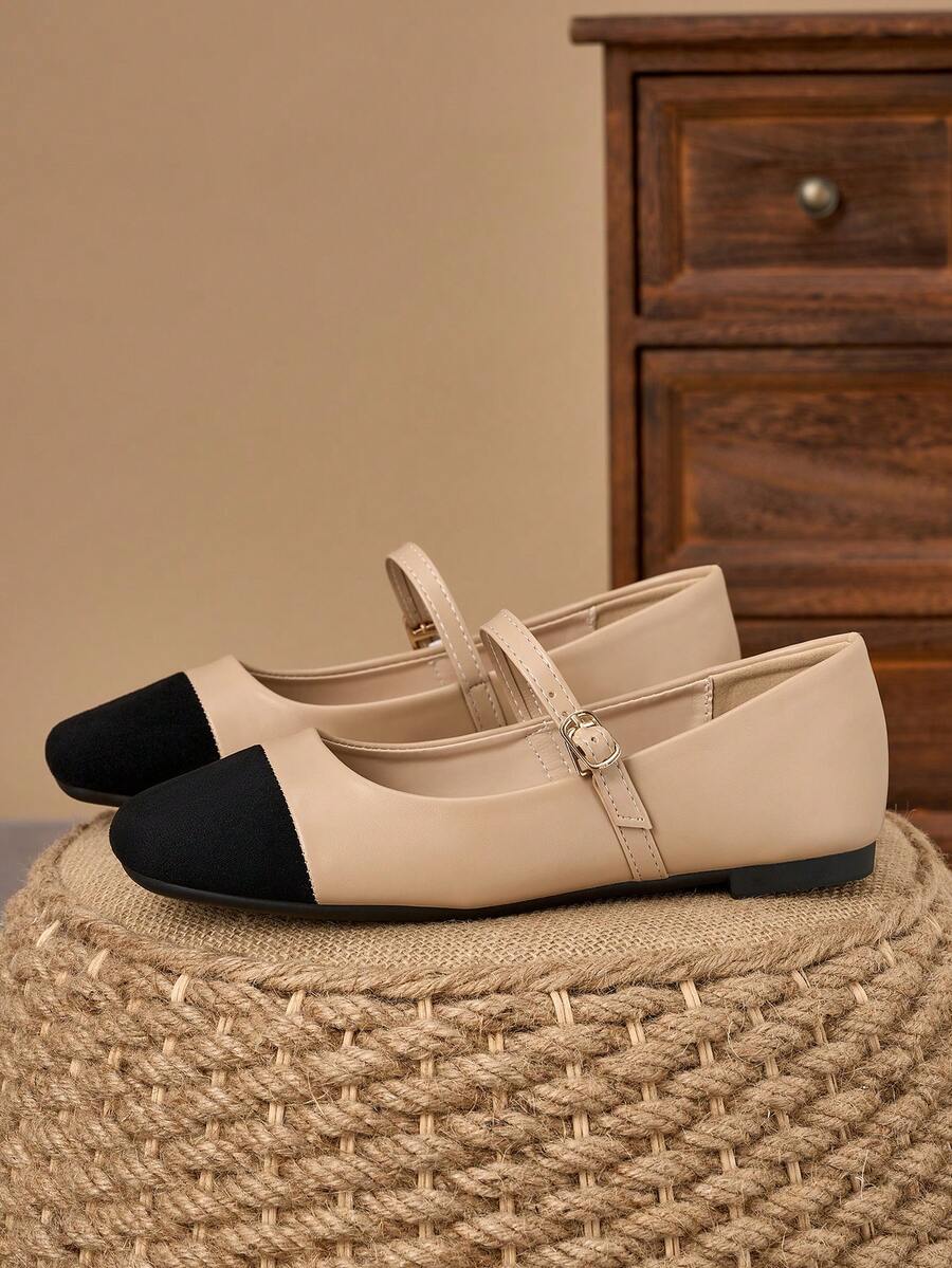 Pair of women's square toe slip-on flat shoes featuring a delicate bow detail and low vamp design.