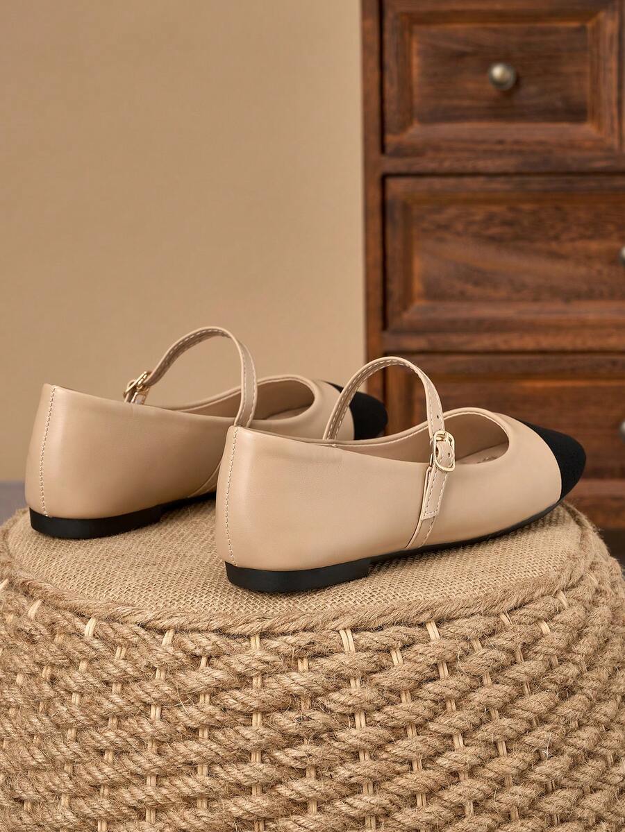 Pair of women's square toe slip-on flat shoes featuring a delicate bow detail and low vamp design.