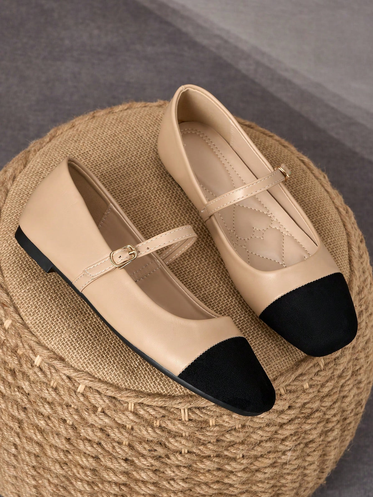 Pair of women's square toe slip-on flat shoes featuring a delicate bow detail and low vamp design.