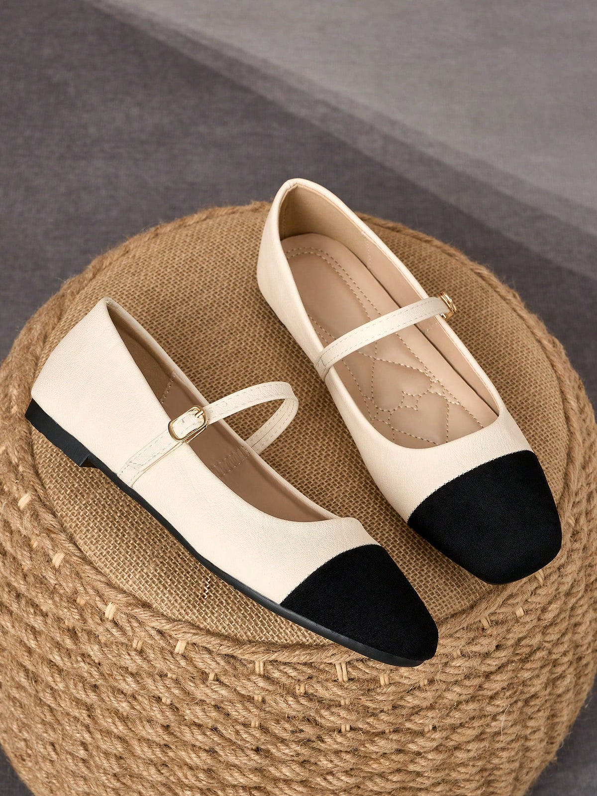 Pair of women's square toe slip-on flat shoes featuring a delicate bow detail and low vamp design.