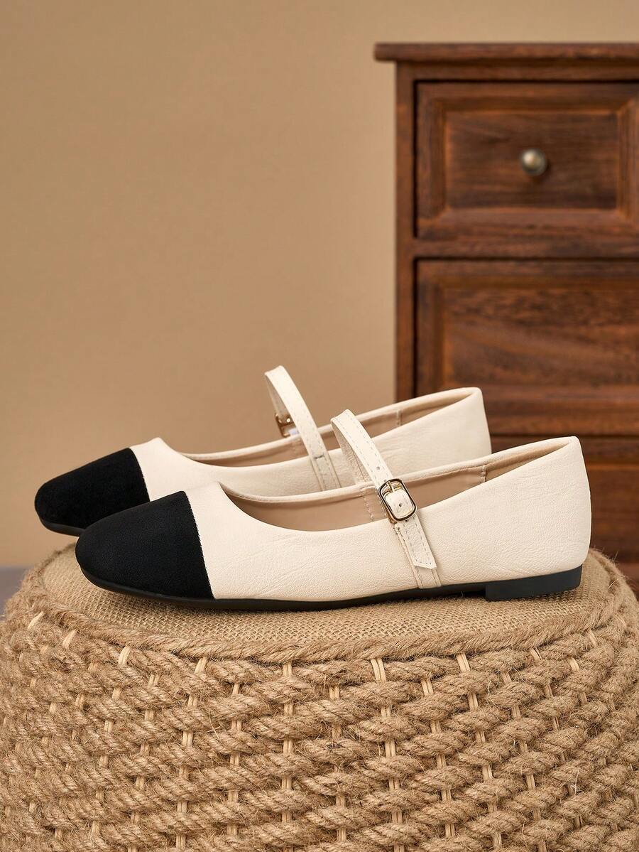 Pair of women's square toe slip-on flat shoes featuring a delicate bow detail and low vamp design.