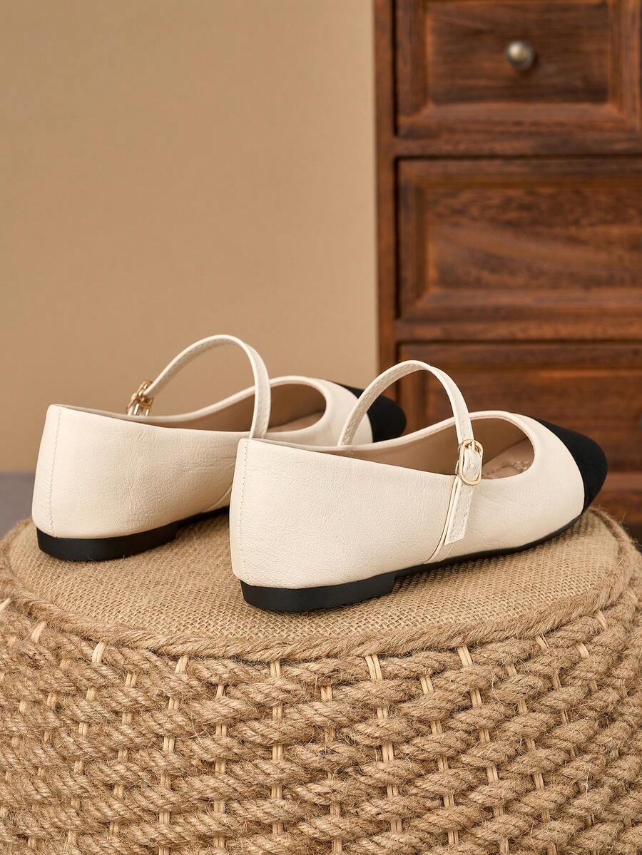 Pair of women's square toe slip-on flat shoes featuring a delicate bow detail and low vamp design.
