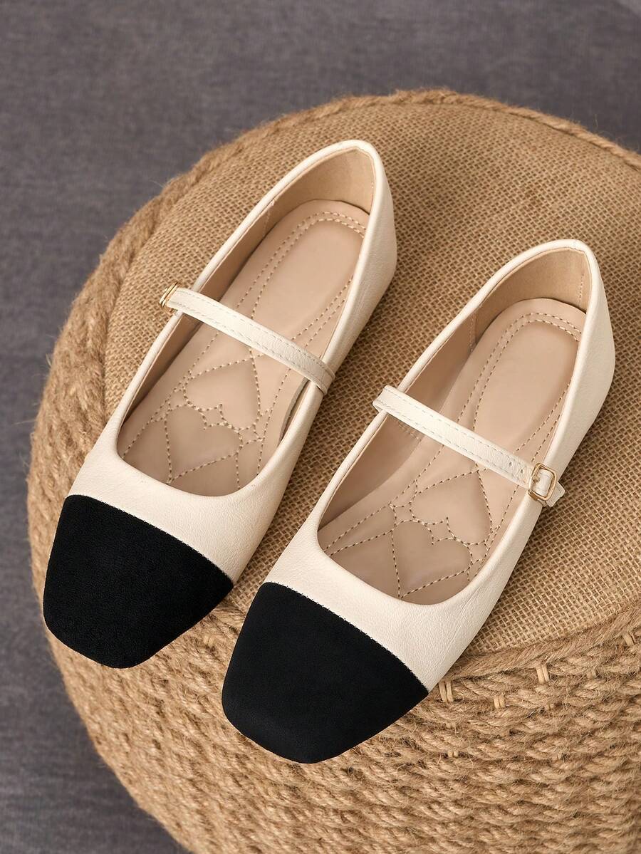 Pair of women's square toe slip-on flat shoes featuring a delicate bow detail and low vamp design.