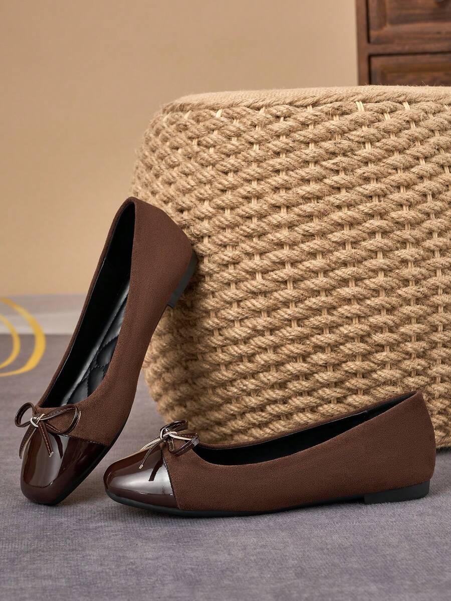 Pair of women's square toe slip-on flat shoes featuring a delicate bow detail and low vamp design.