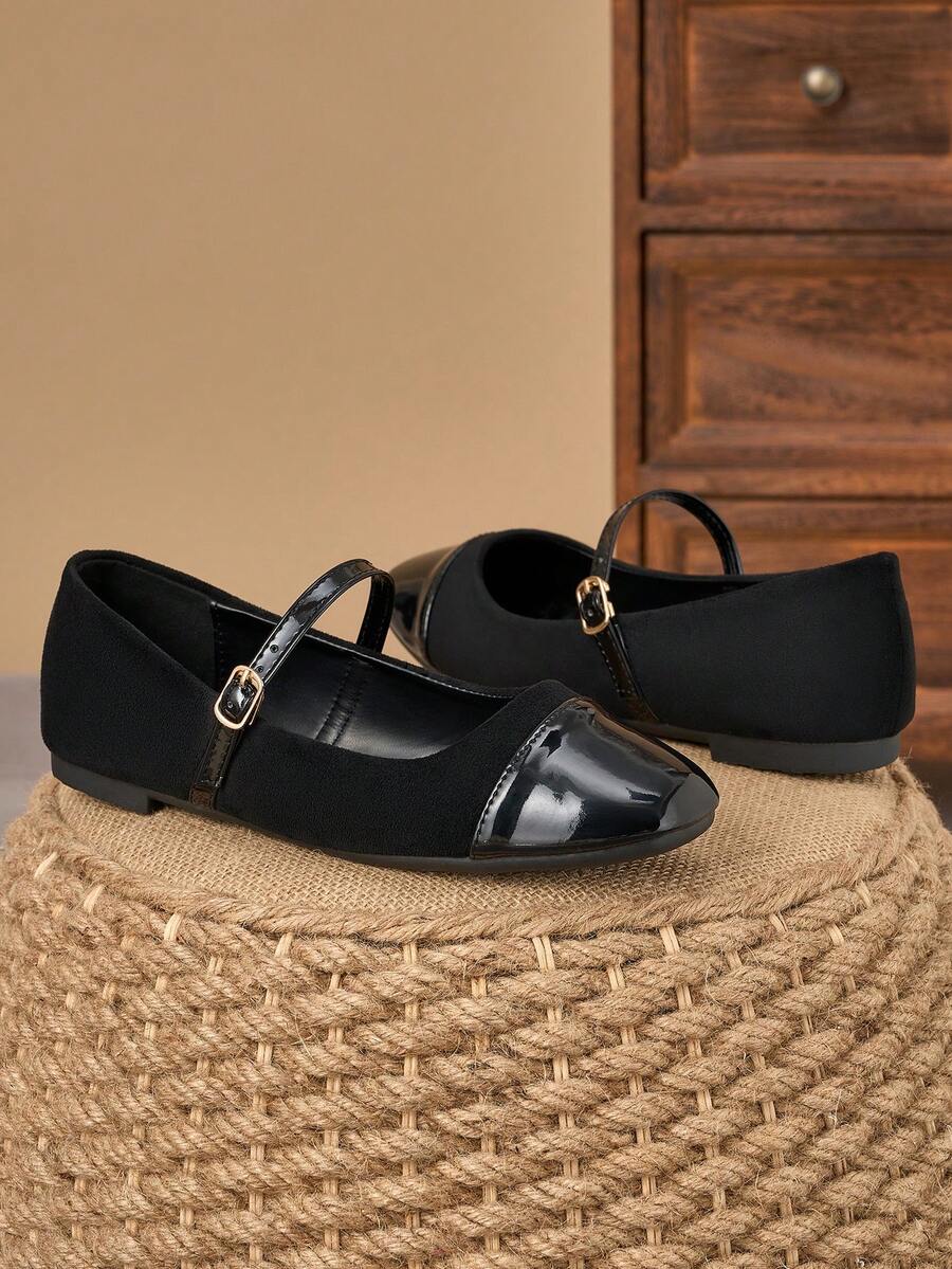 Pair of women's square toe slip-on flat shoes featuring a delicate bow detail and low vamp design.