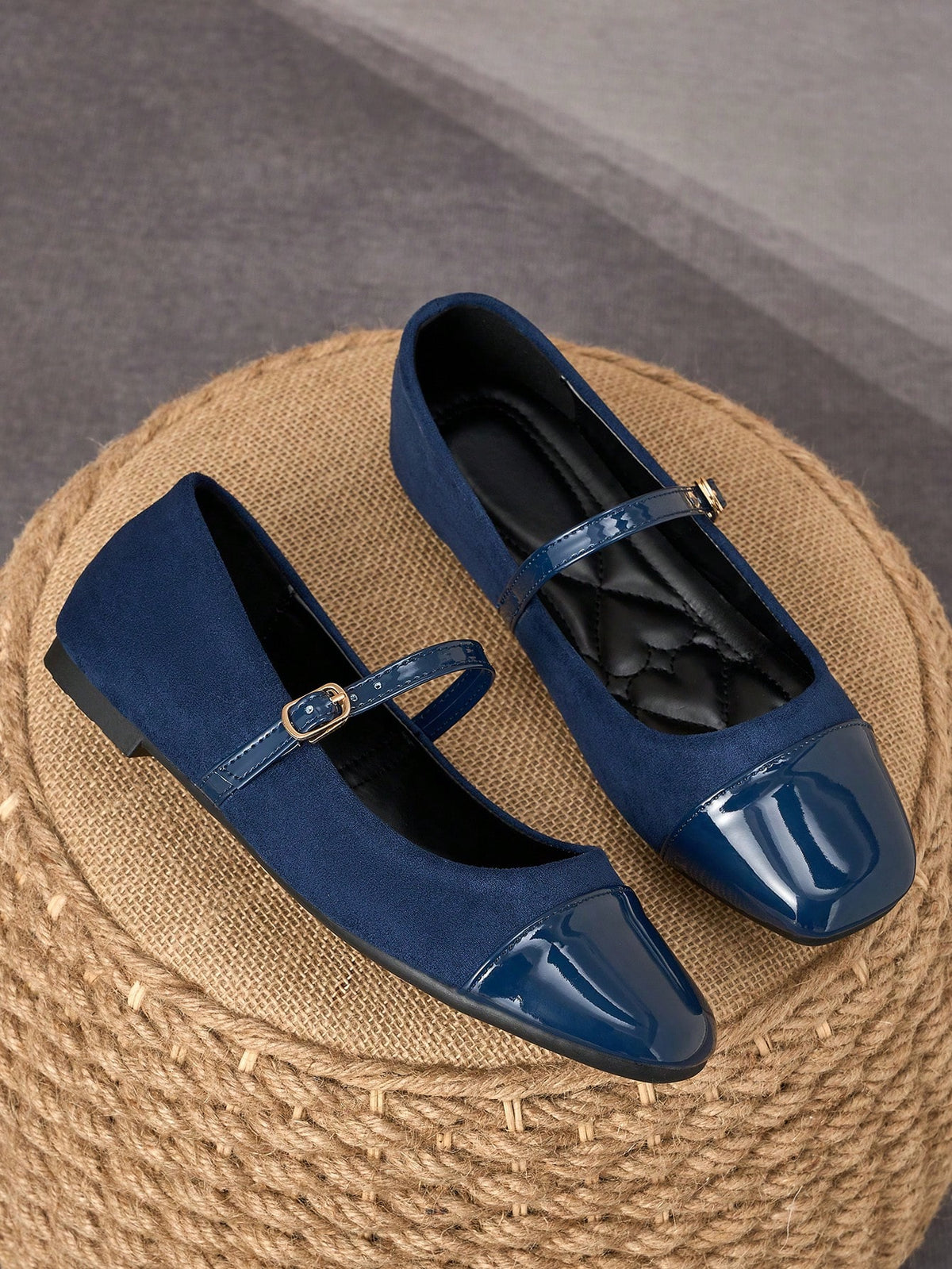 Pair of women's square toe slip-on flat shoes featuring a delicate bow detail and low vamp design.