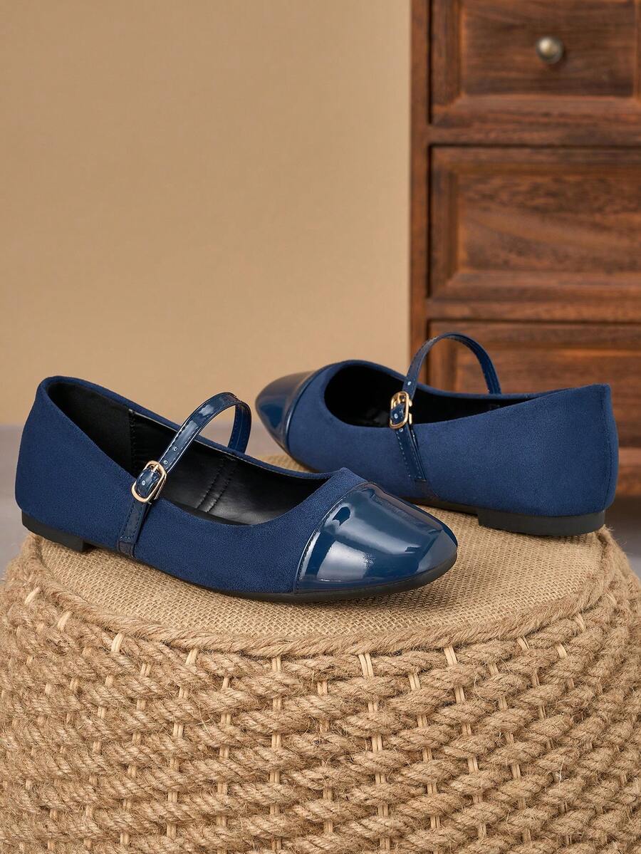 Pair of women's square toe slip-on flat shoes featuring a delicate bow detail and low vamp design.