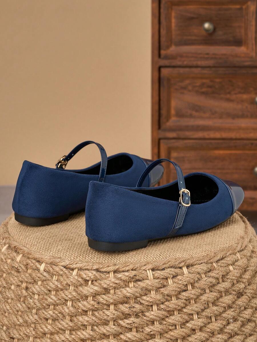 Pair of women's square toe slip-on flat shoes featuring a delicate bow detail and low vamp design.