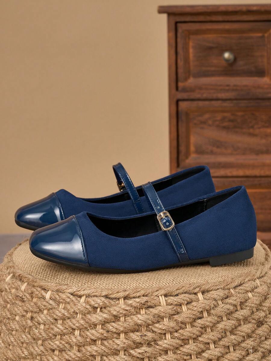Pair of women's square toe slip-on flat shoes featuring a delicate bow detail and low vamp design.