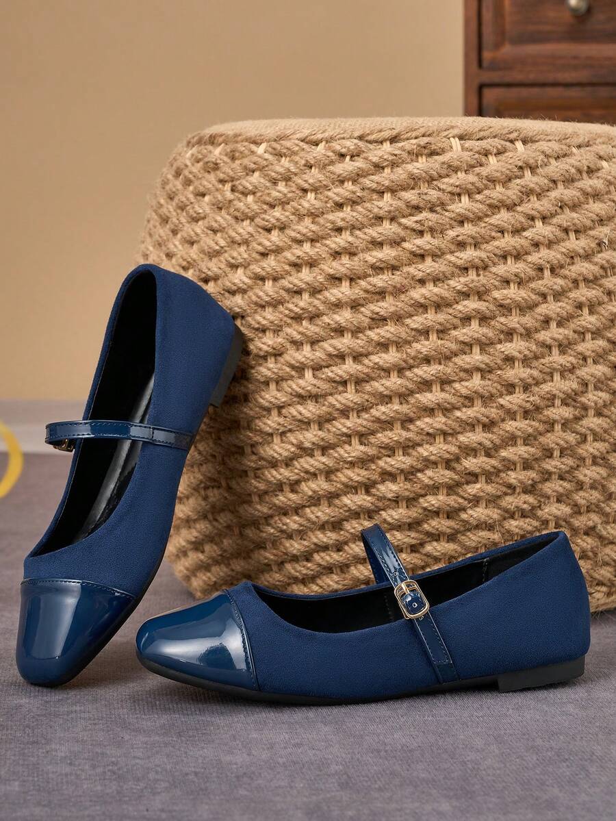 Pair of women's square toe slip-on flat shoes featuring a delicate bow detail and low vamp design.