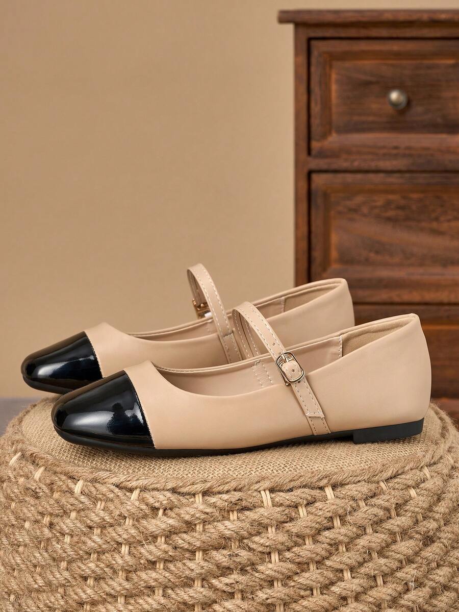 Pair of women's square toe slip-on flat shoes featuring a delicate bow detail and low vamp design.