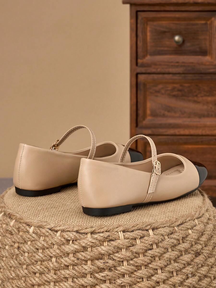 Pair of women's square toe slip-on flat shoes featuring a delicate bow detail and low vamp design.