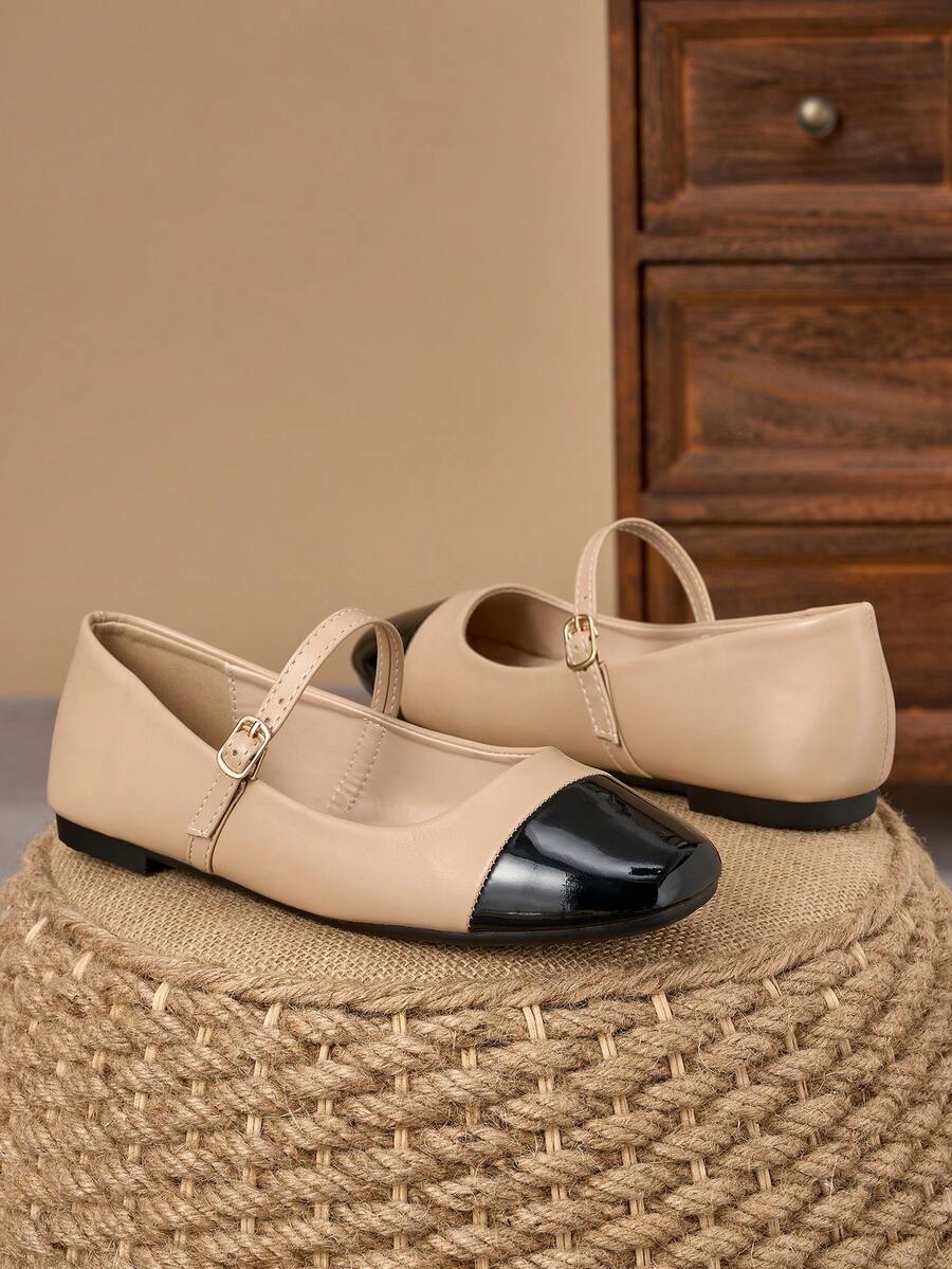Pair of women's square toe slip-on flat shoes featuring a delicate bow detail and low vamp design.