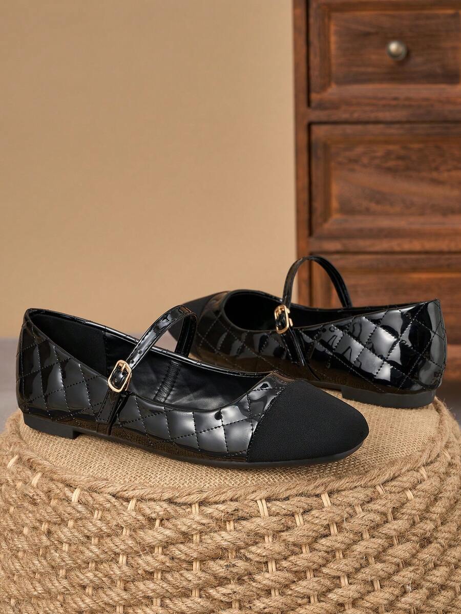 Pair of women's square toe slip-on flat shoes featuring a delicate bow detail and low vamp design.