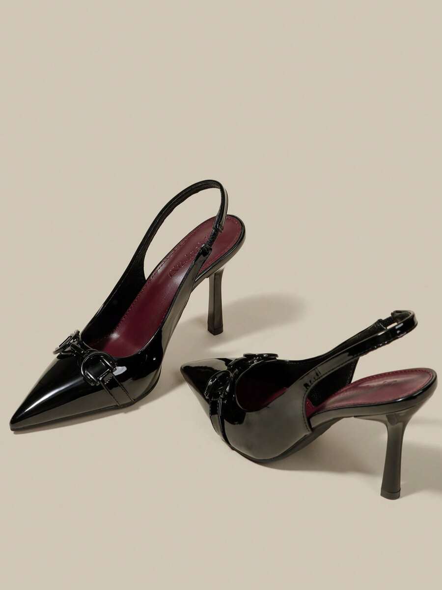 Women's pointed toe kitten heel pumps with adjustable buckle back strap and sleek patent finish.