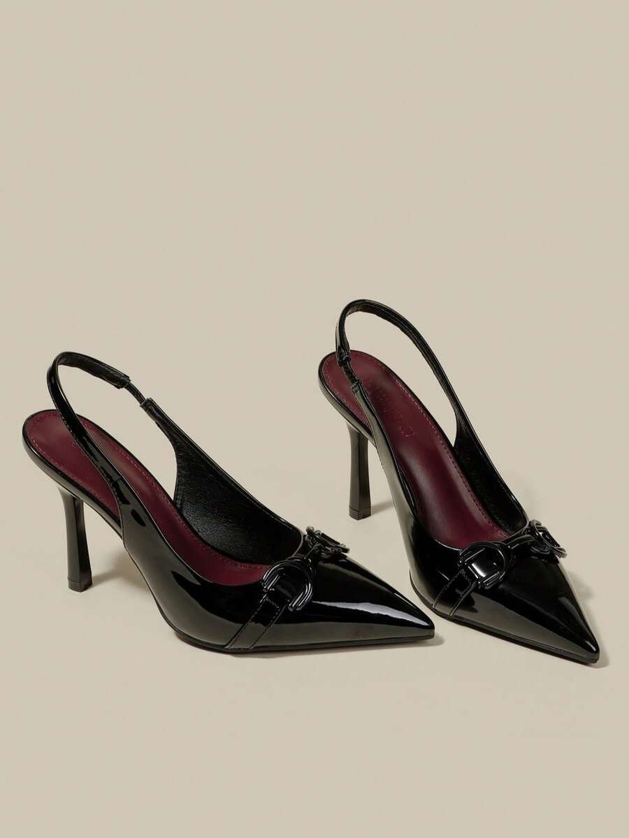 Women's pointed toe kitten heel pumps with adjustable buckle back strap and sleek patent finish.