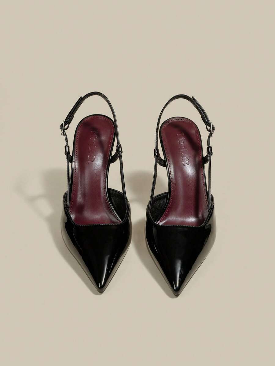 Women's pointed toe kitten heel pumps with adjustable buckle back strap and sleek patent finish.