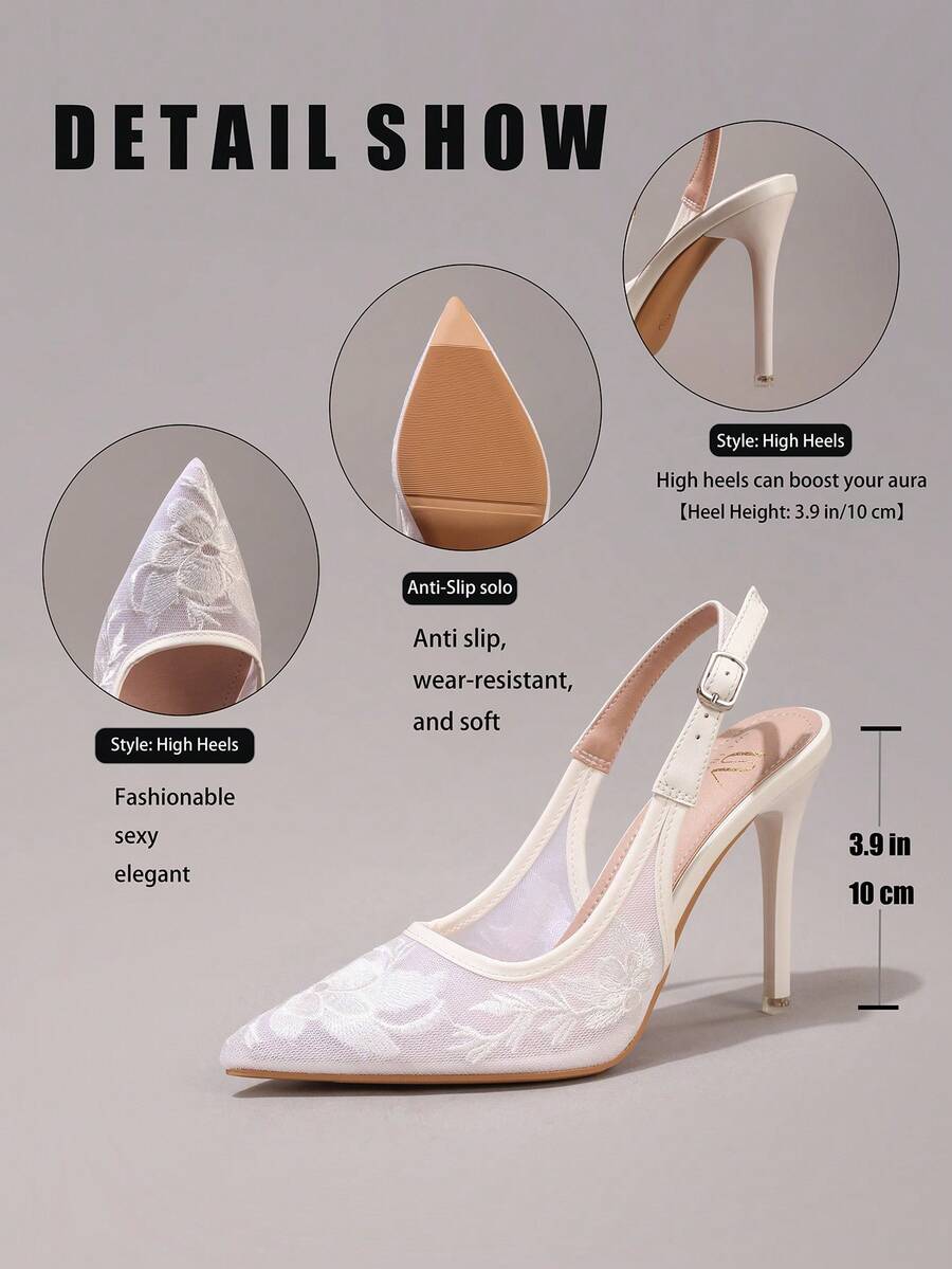 Lace embroidered high heels with thin stiletto heel, pointed toe, rhinestone embellishments, and ankle strap buckle closure.