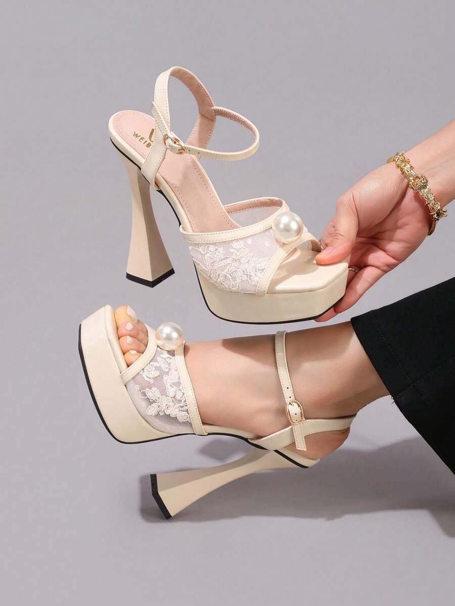 Lace embroidered open toe high heel sandals featuring a chunky square heel, platform wedge, and ankle strap buckle closure.