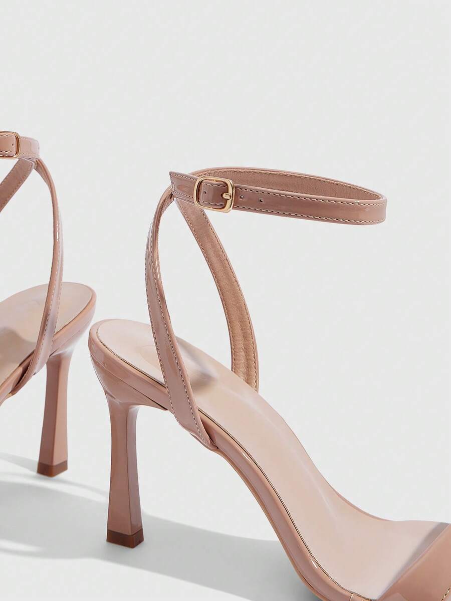 Women's high heel ankle strap sandals with open toe and stiletto heel in mirror black finish.