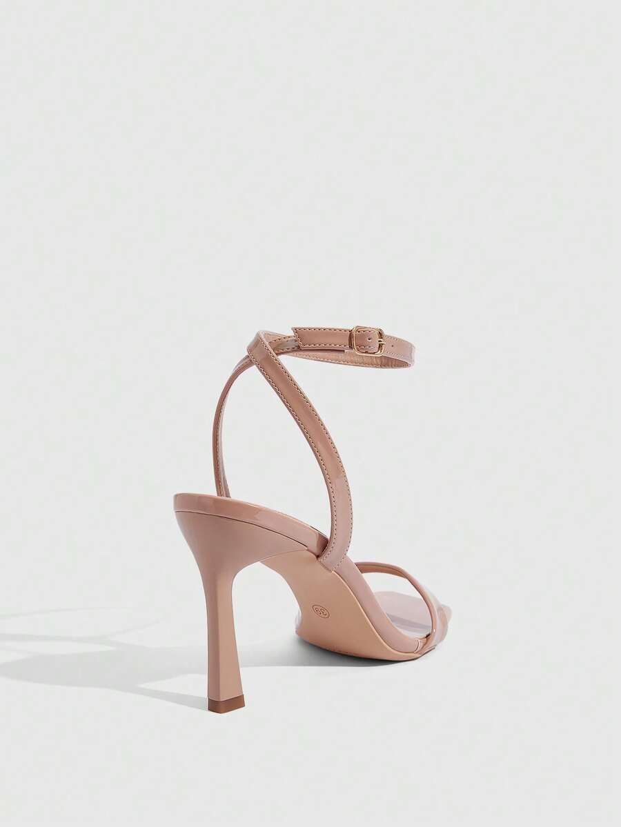 Women's high heel ankle strap sandals with open toe and stiletto heel in mirror black finish.