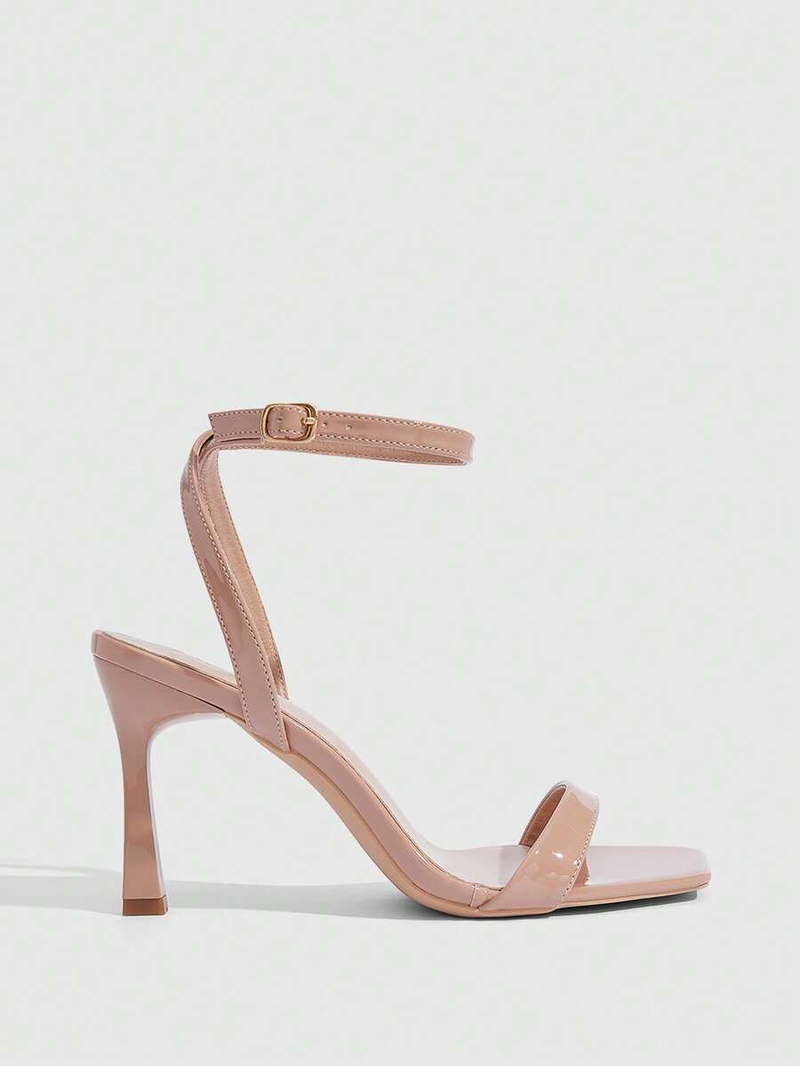 Women's high heel ankle strap sandals with open toe and stiletto heel in mirror black finish.