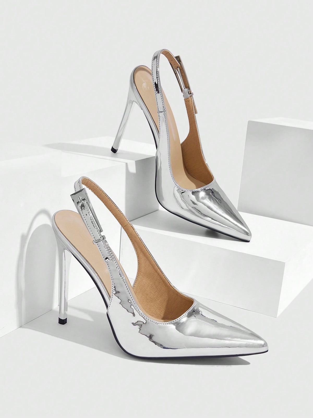 Pointed toe stiletto high heel evening party pumps featuring an ankle strap with buckle closure.