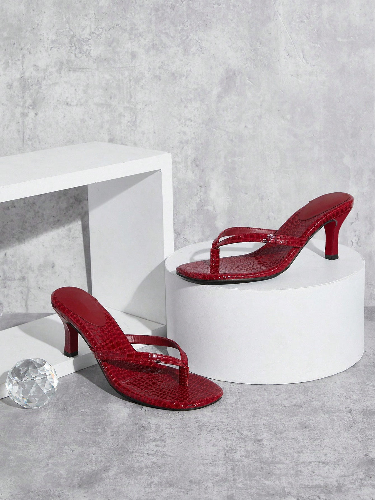 Women's minimalist black PU leather thong heel sandals featuring kitten heels and rhinestone accents