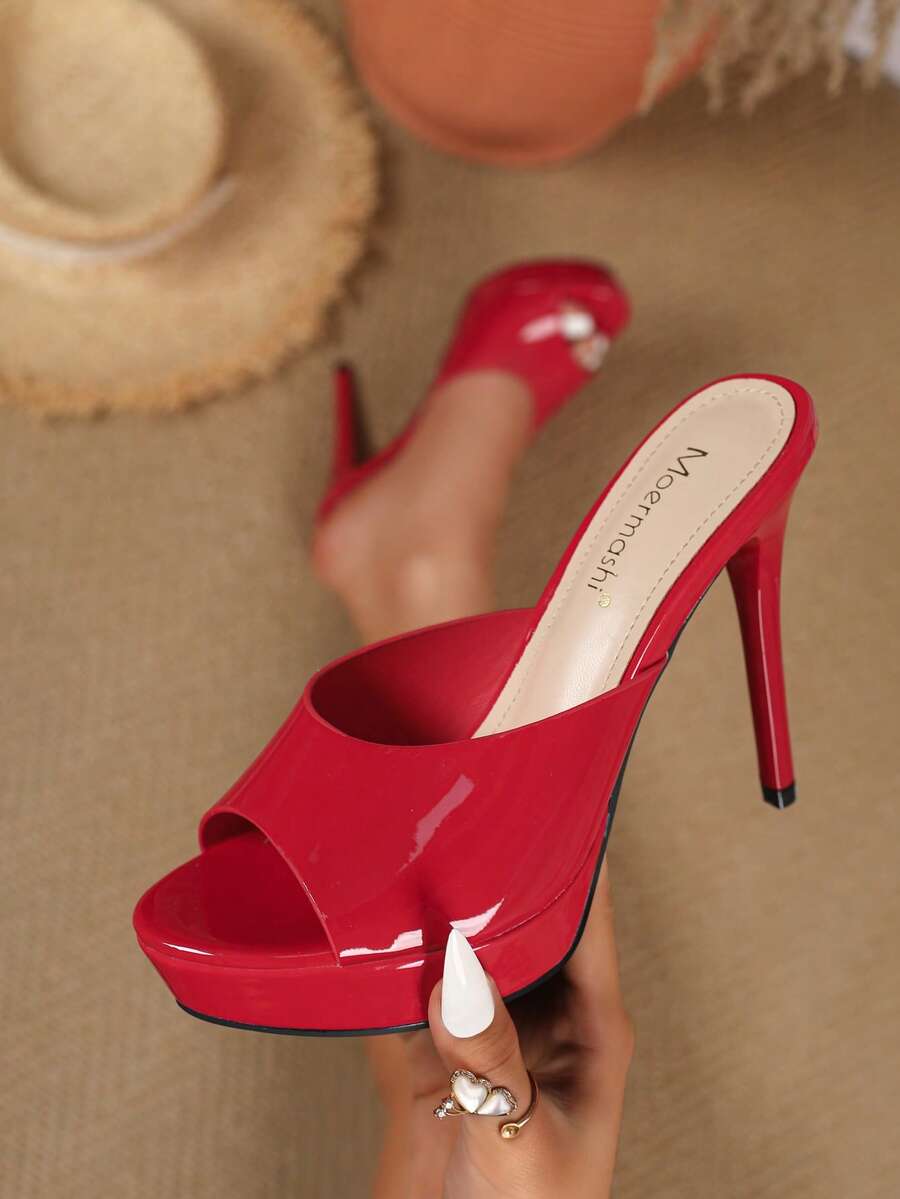 Women's patent leather stiletto heel sandals with open toe ruched slip on mule design.