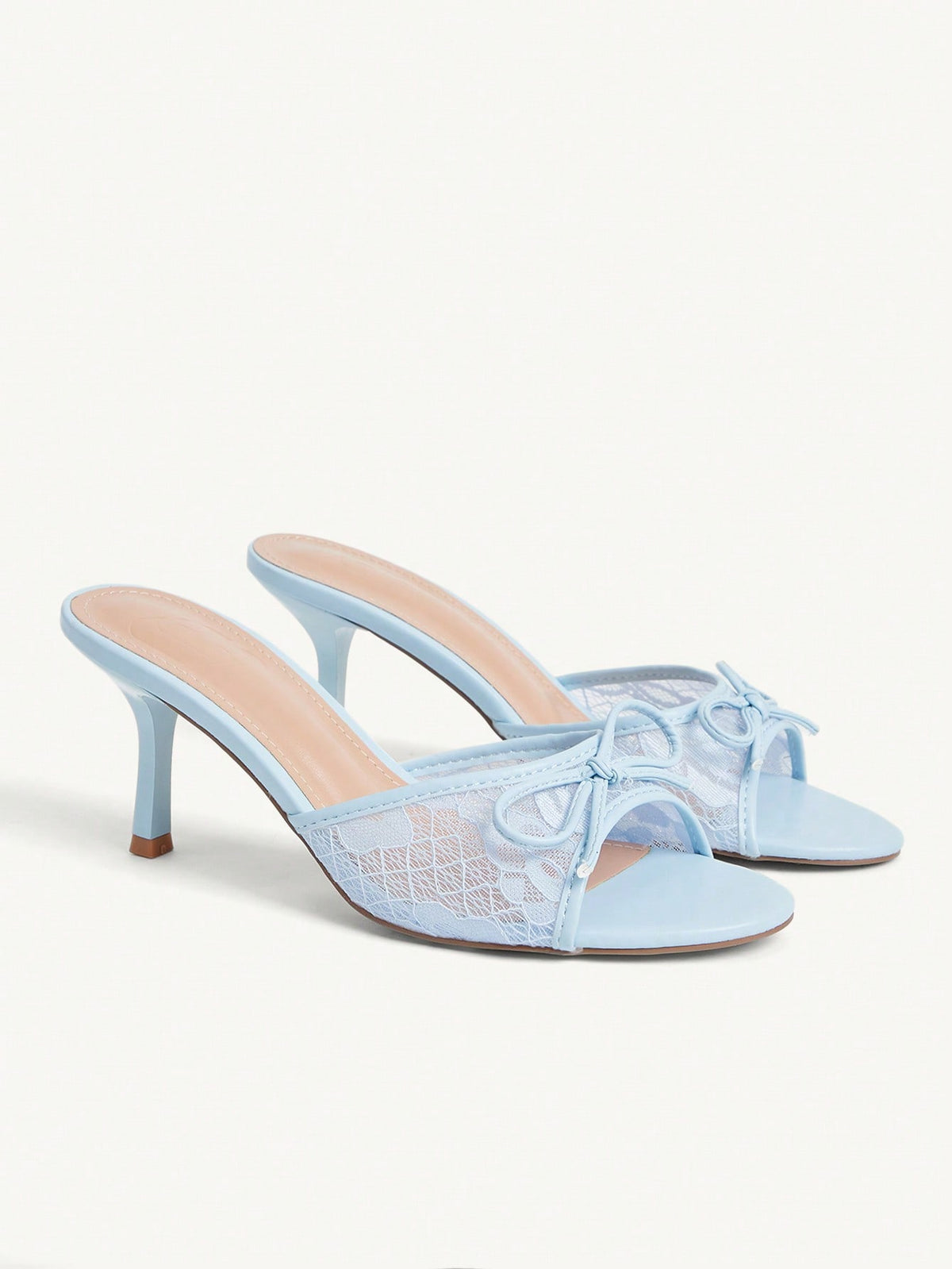Open toe high heel slide sandals featuring lace details and a bow accent on the upper strap.