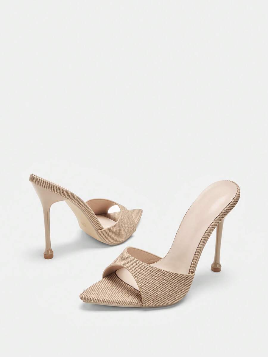 Pointed toe bowknot stiletto high heel mule sandals in white featuring a sleek slip-on open back design