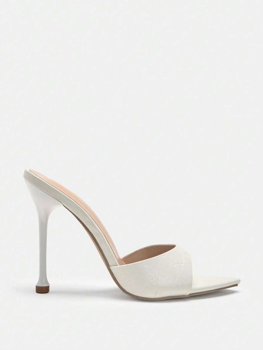 Pointed toe bowknot stiletto high heel mule sandals in white featuring a sleek slip-on open back design