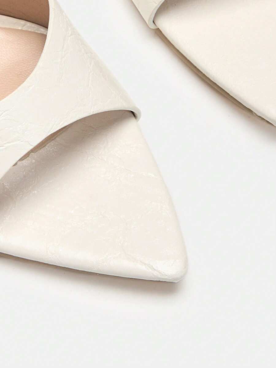 Pointed toe bowknot stiletto high heel mule sandals in white featuring a sleek slip-on open back design