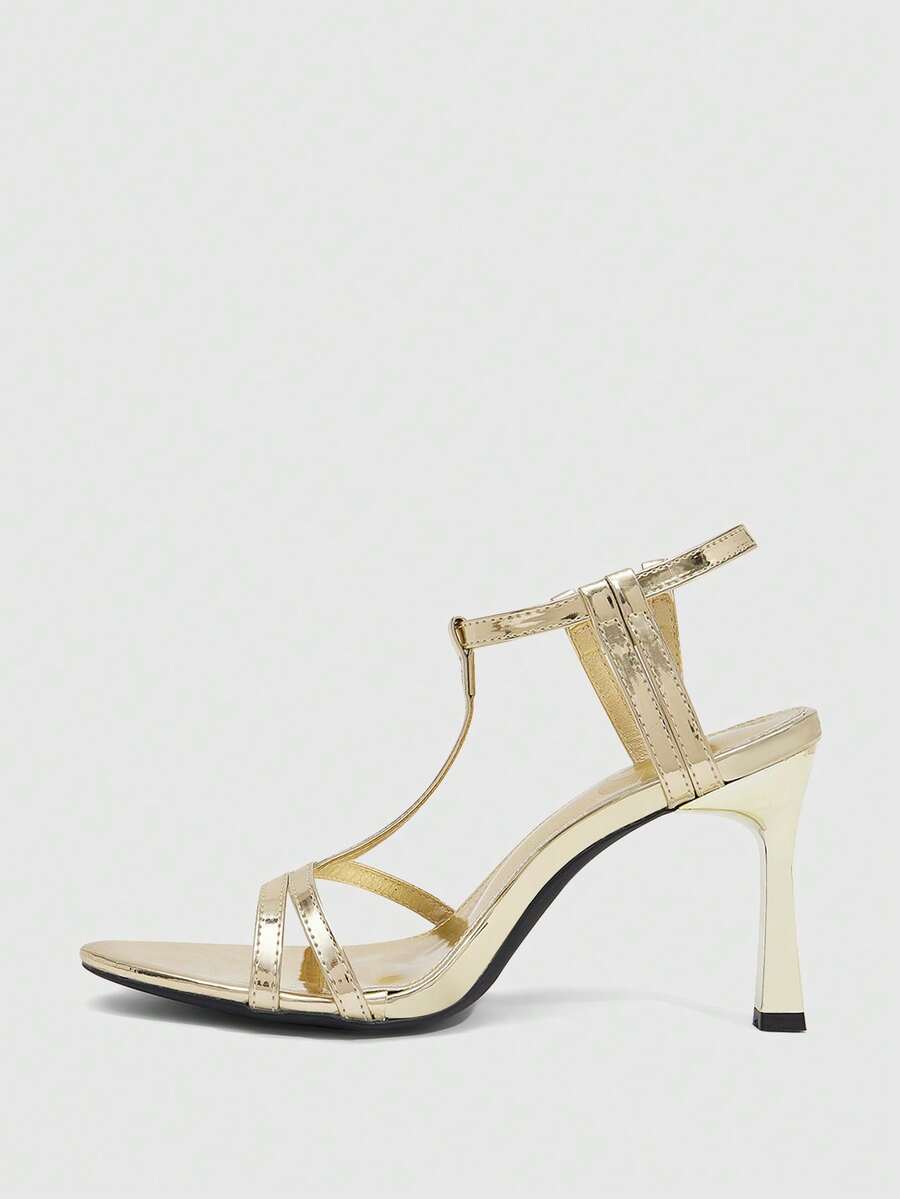 Milk apricot open toe high-heeled sandals with adjustable ankle buckle strap and stiletto heel for ladies.