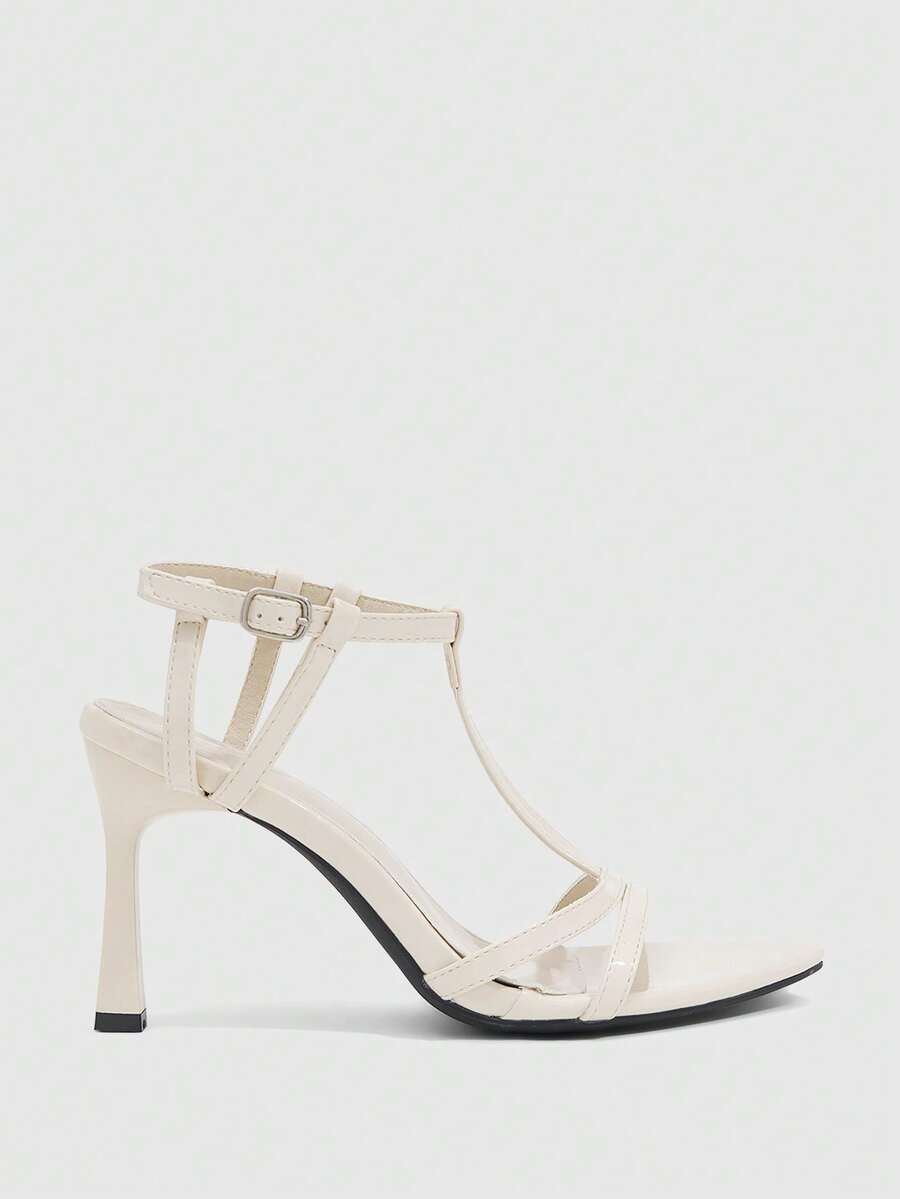 Milk apricot open toe high-heeled sandals with adjustable ankle buckle strap and stiletto heel for ladies.