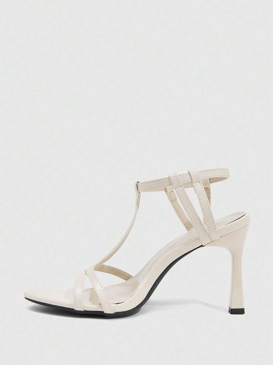Milk apricot open toe high-heeled sandals with adjustable ankle buckle strap and stiletto heel for ladies.