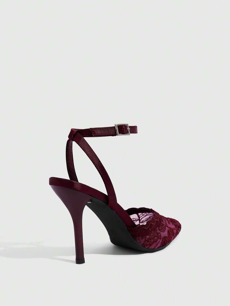 Women's stiletto high heel shoes featuring an elegant buckle detail and ankle strap slingback design.