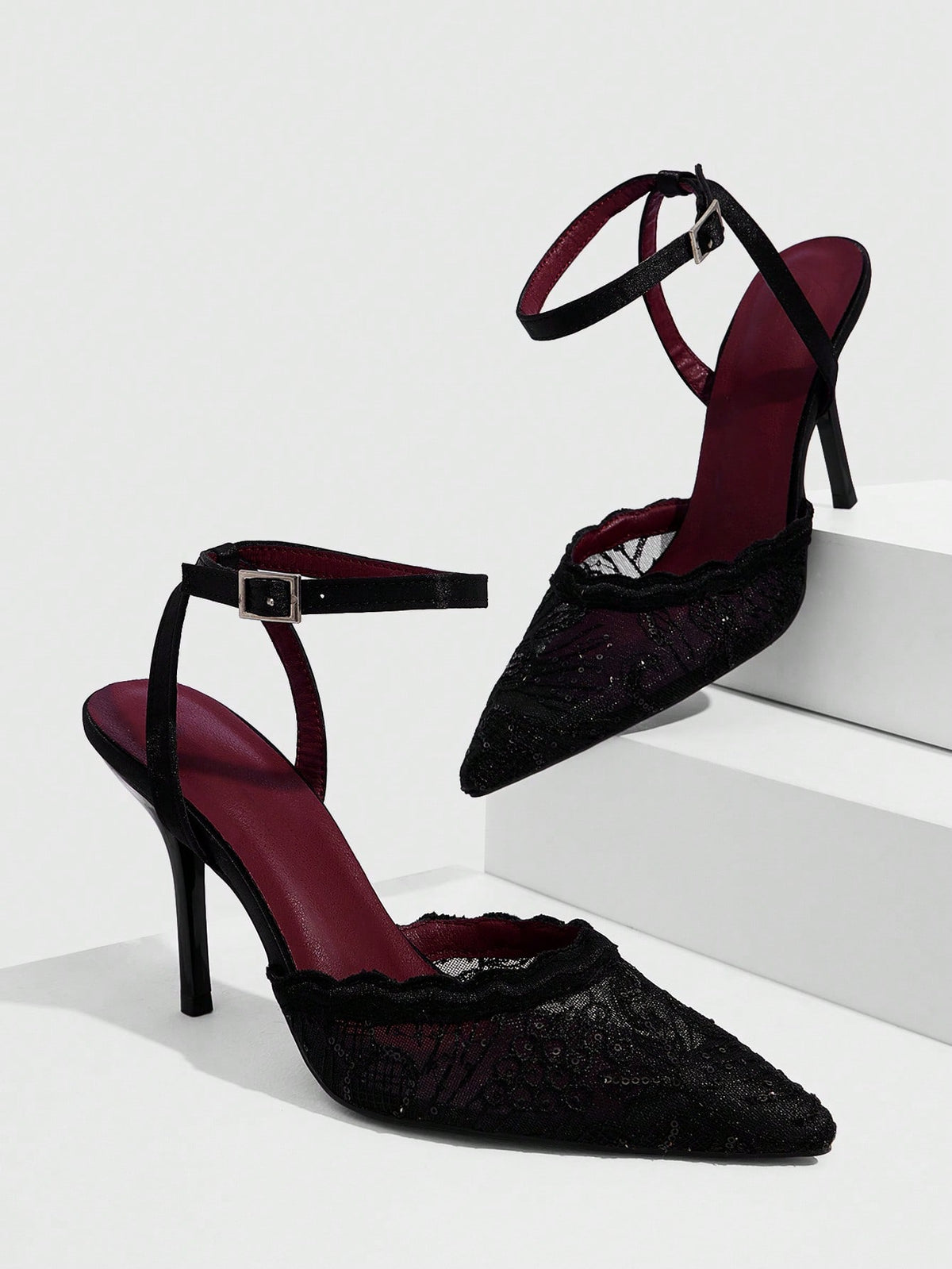 Women's stiletto high heel shoes featuring an elegant buckle detail and ankle strap slingback design.