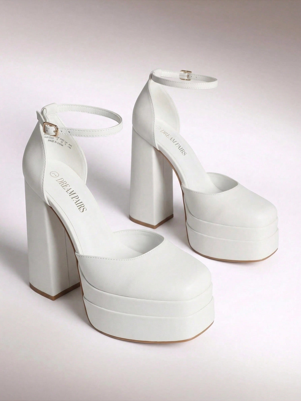Women's ultra high platform block heels in smooth PU leather with square toe and adjustable buckle ankle strap.