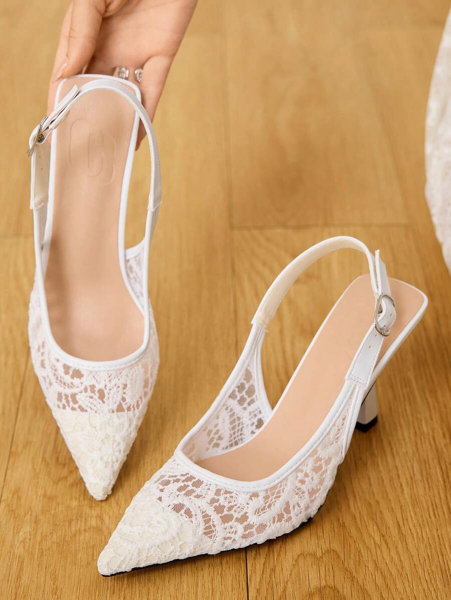 Pointed toe stiletto high heel pumps featuring black lace mesh upper, buckle slingback detail, and sleek slip-on design for weddings and evening wear.