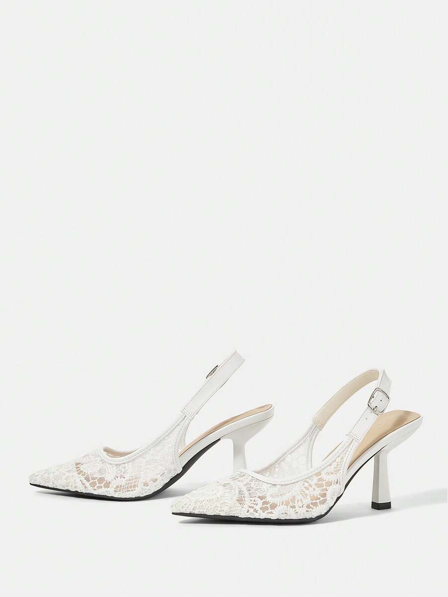 Pointed toe stiletto high heel pumps featuring black lace mesh upper, buckle slingback detail, and sleek slip-on design for weddings and evening wear.