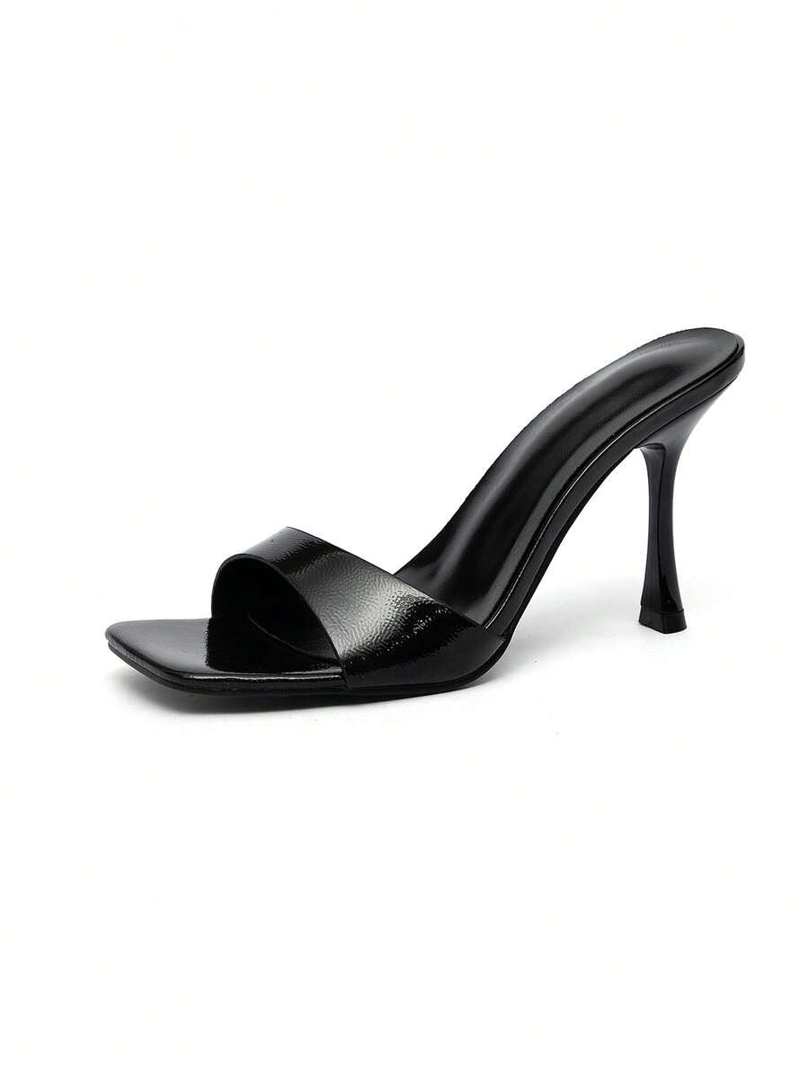 Square toe hollow out mule sandals featuring high stiletto heels and cut out upper design in smooth faux leather.