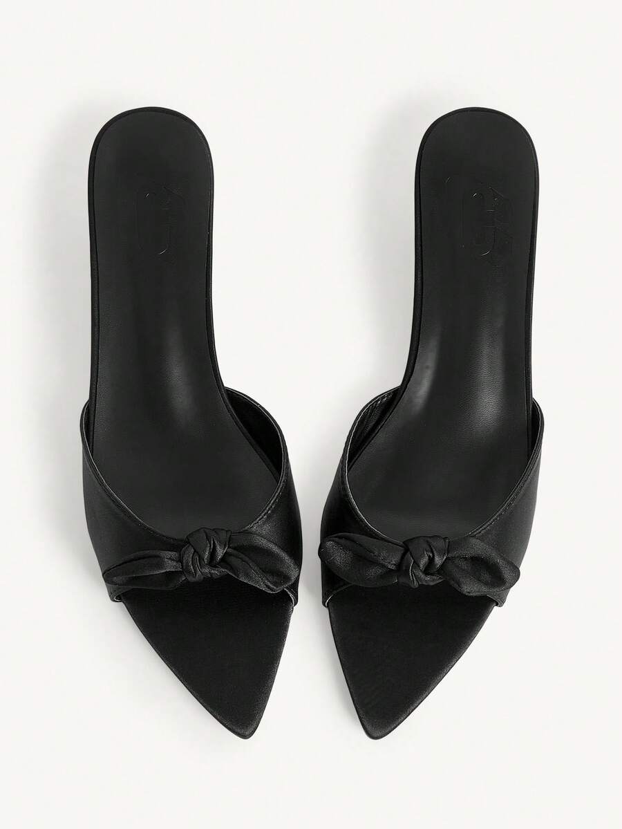 Pointed toe high-heeled slippers in PU leather with decorative buckle detail and low kitten heels for women.