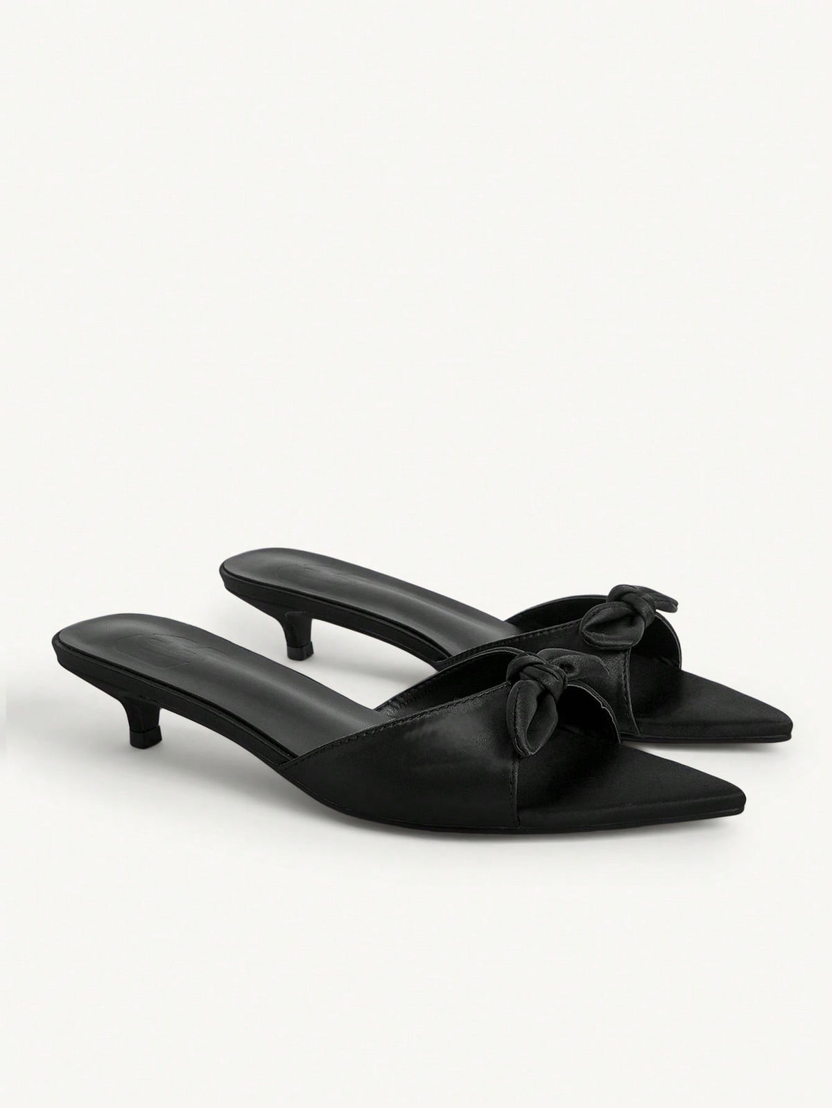 Pointed toe high-heeled slippers in PU leather with decorative buckle detail and low kitten heels for women.