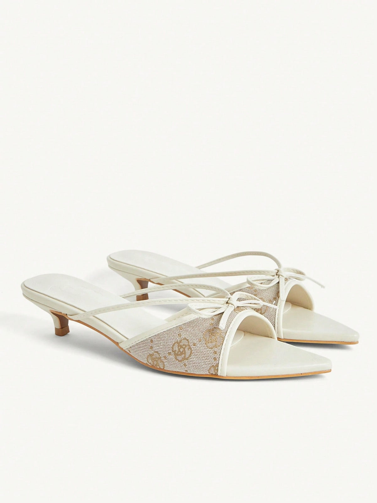 Pointed toe high-heeled slippers in PU leather with decorative buckle detail and low kitten heels for women.