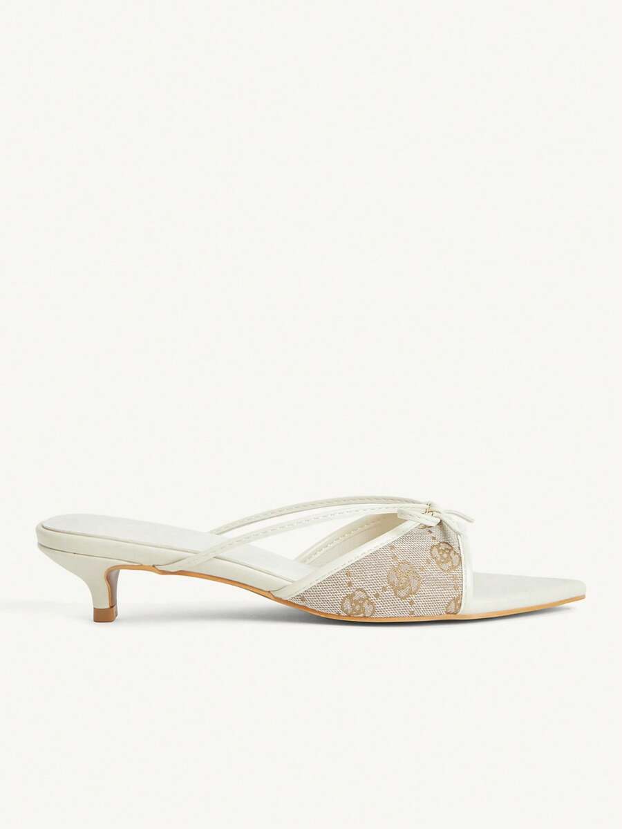 Pointed toe high-heeled slippers in PU leather with decorative buckle detail and low kitten heels for women.
