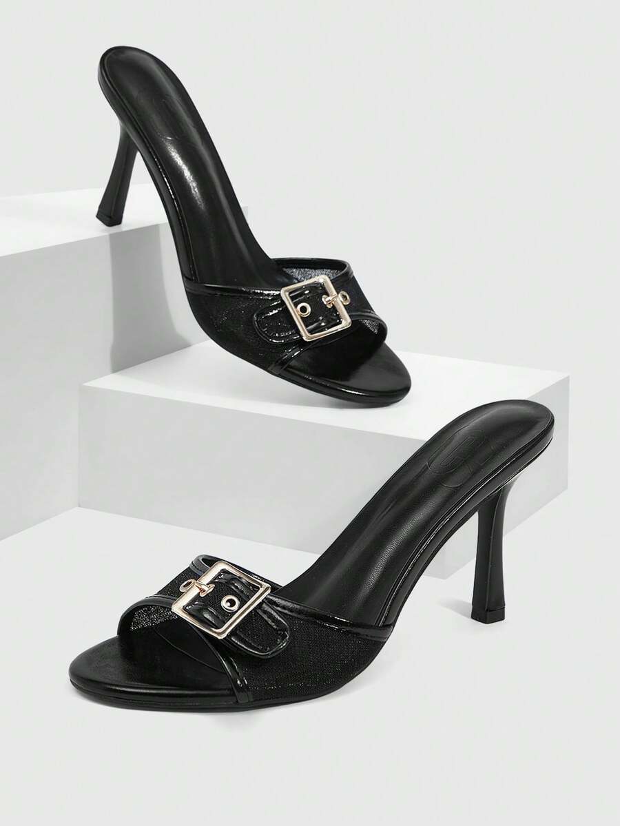 Women's black open round toe high heel slippers featuring mesh stitching, grommet buckle strap, and stiletto heel.