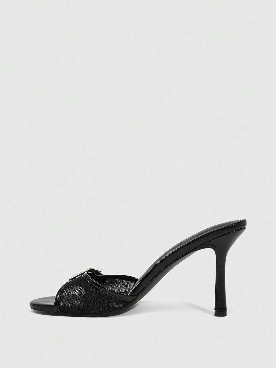 Women's black open round toe high heel slippers featuring mesh stitching, grommet buckle strap, and stiletto heel.
