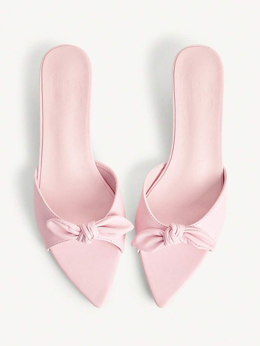 Pointed toe high-heeled slippers in PU leather with decorative buckle detail and low kitten heels for women.