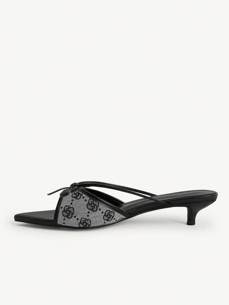 Pointed toe high-heeled slippers in PU leather with decorative buckle detail and low kitten heels for women.